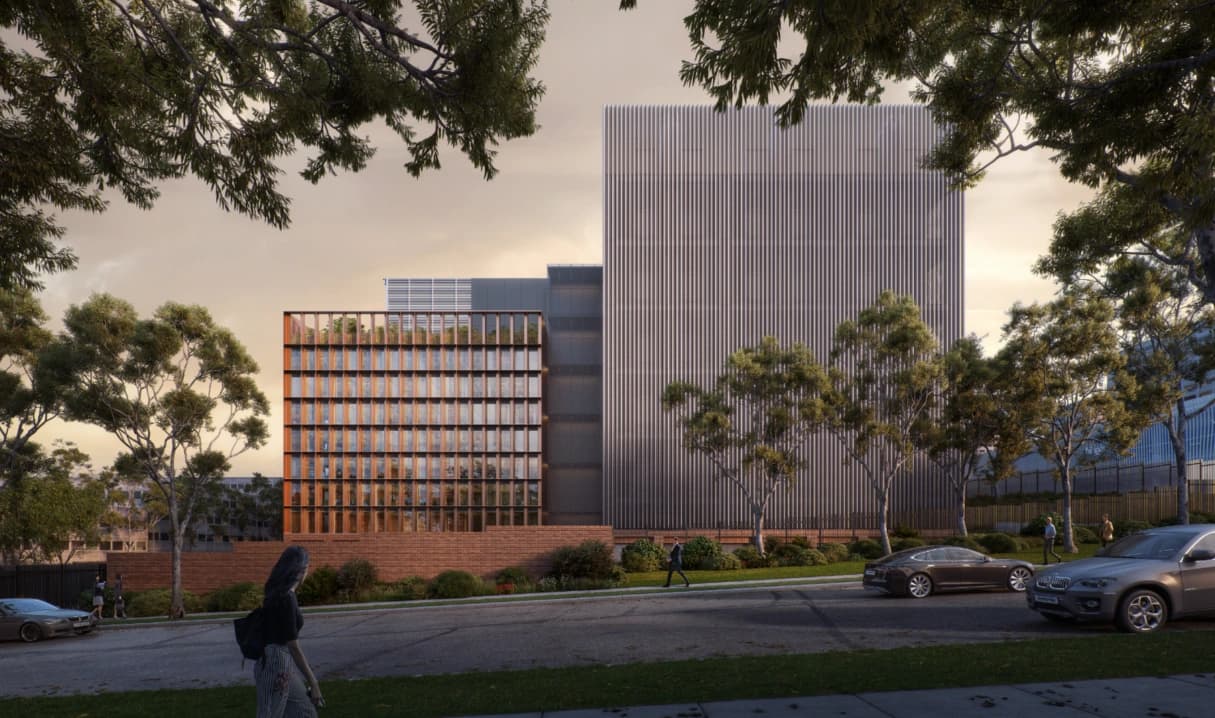 Rendu architectural moderne de bâtiments urbains aux façades uniques, avec arbres et voitures au coucher du soleil.